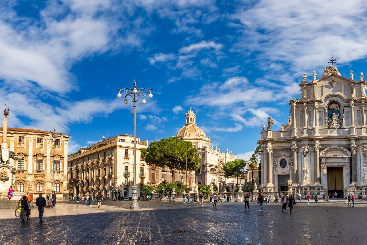 Luxury private vehicle for Catania airport transfer from Taormina Sicily, Scenic coastal route from Taormina to Catania with Mount Etna in background, Professional English-speaking driver for VIP Sicily airport transfer, Catania Fontanarossa Airport terminal with Mount Etna volcanic landscape