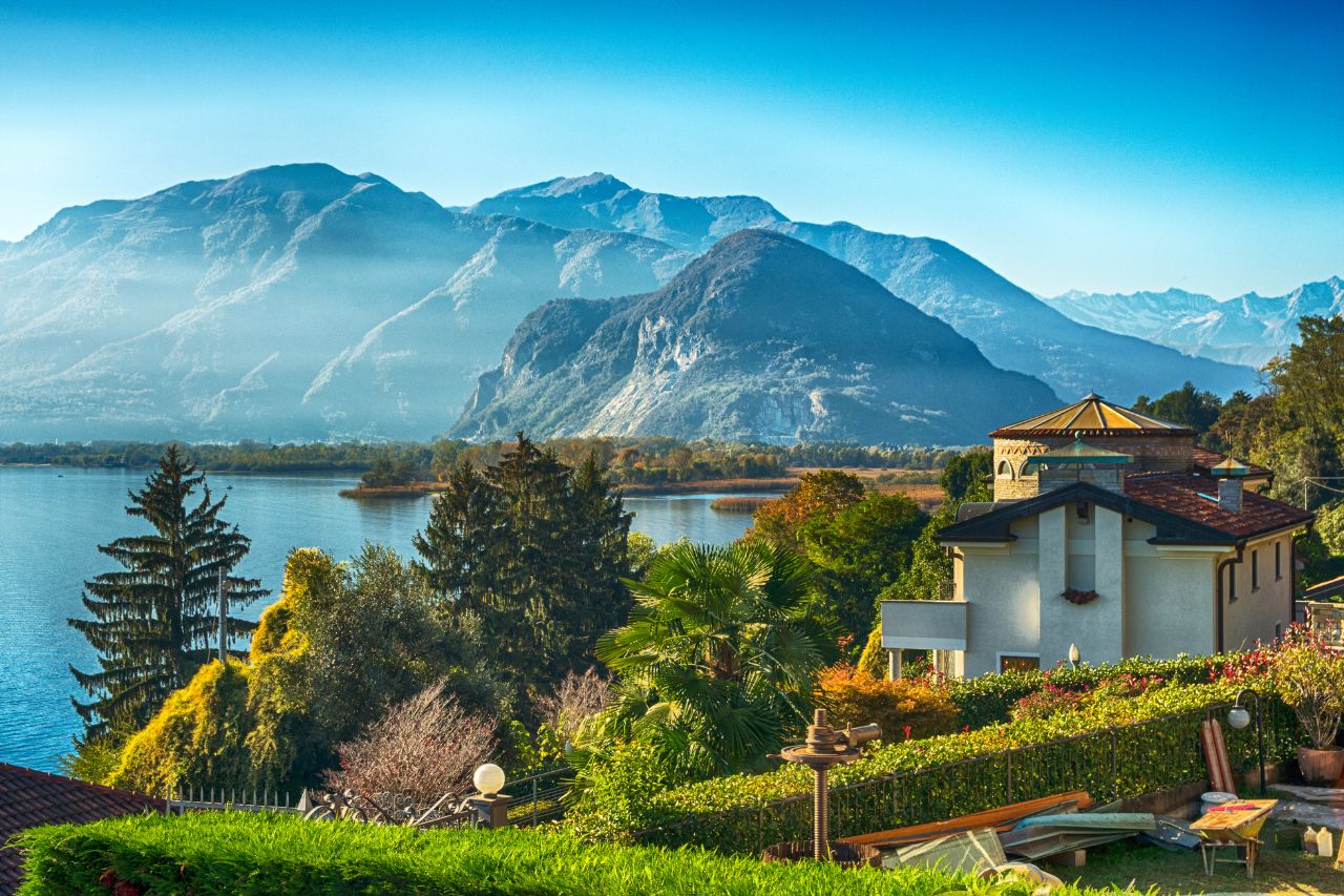 luxury Stresa Lake Maggiore, Borromean Islands private tour, Villa Palazzo Aminta, Lake Maggiore boat excursion, Italian lakes luxury hotel, Luxury lake view room at Villa Palazzo Aminta Hotel Stresa with balcony, Private mahogany boat approaching Isola Bella Borromean Islands, Ten-terraced Italian gardens at Isola Bella Palace Lake Maggiore, White peacock strolling through Isola Bella botanical gardens, Venetian terrazzo floors and marble columns at Villa Aminta lobby, Panoramic view of Stresa and Lake Maggiore from alpine perspective, Baroque palace interior at Isola Bella with priceless art collection, Fresh lake fish dish at Isola dei Pescatori restaurant, Colorful peacocks in botanical gardens at Isola Madre, Private boat cruising Lake Maggiore with alpine mountain backdrop.